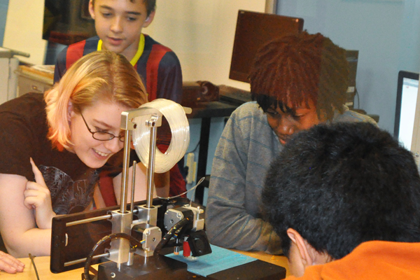Crossroads students observe 3D printer