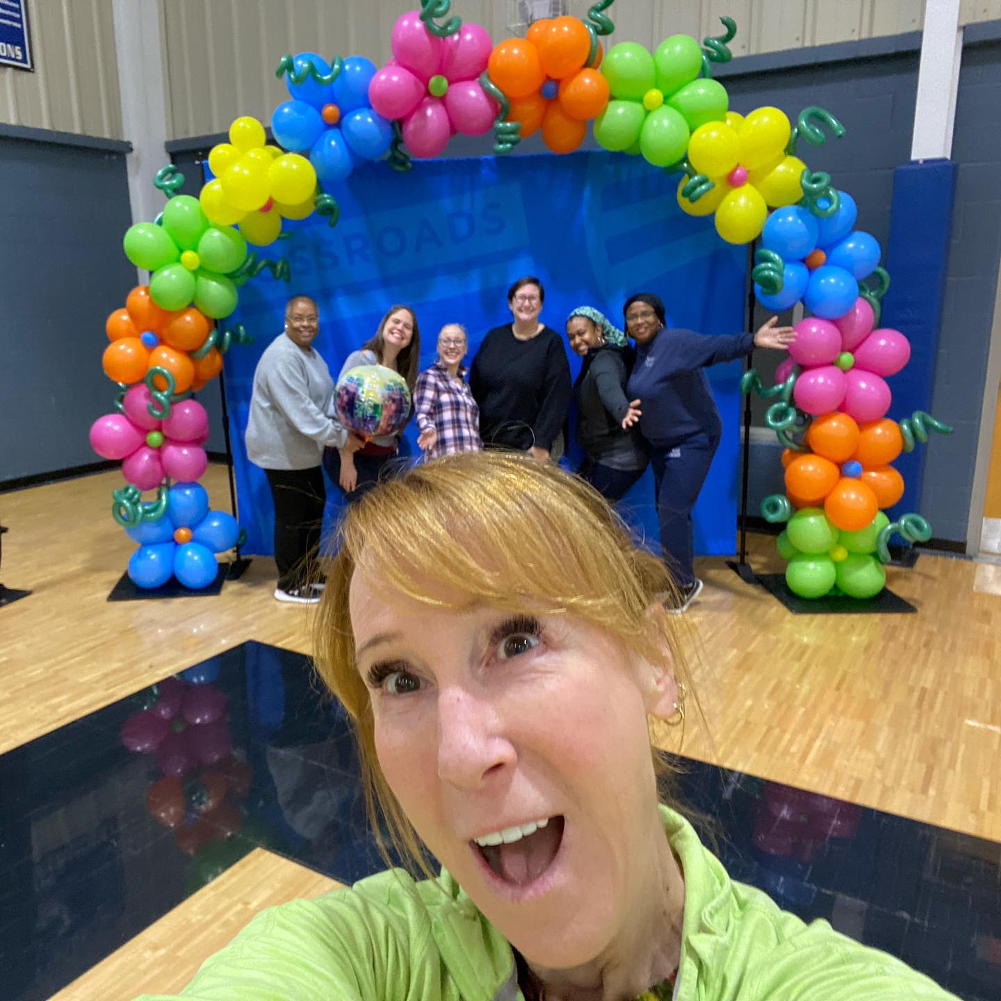 Crossroads families helping set up a fundraising event for scholarship